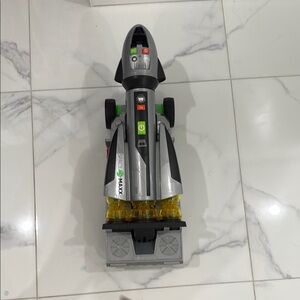 Silver and Green Space Vehicle Toy